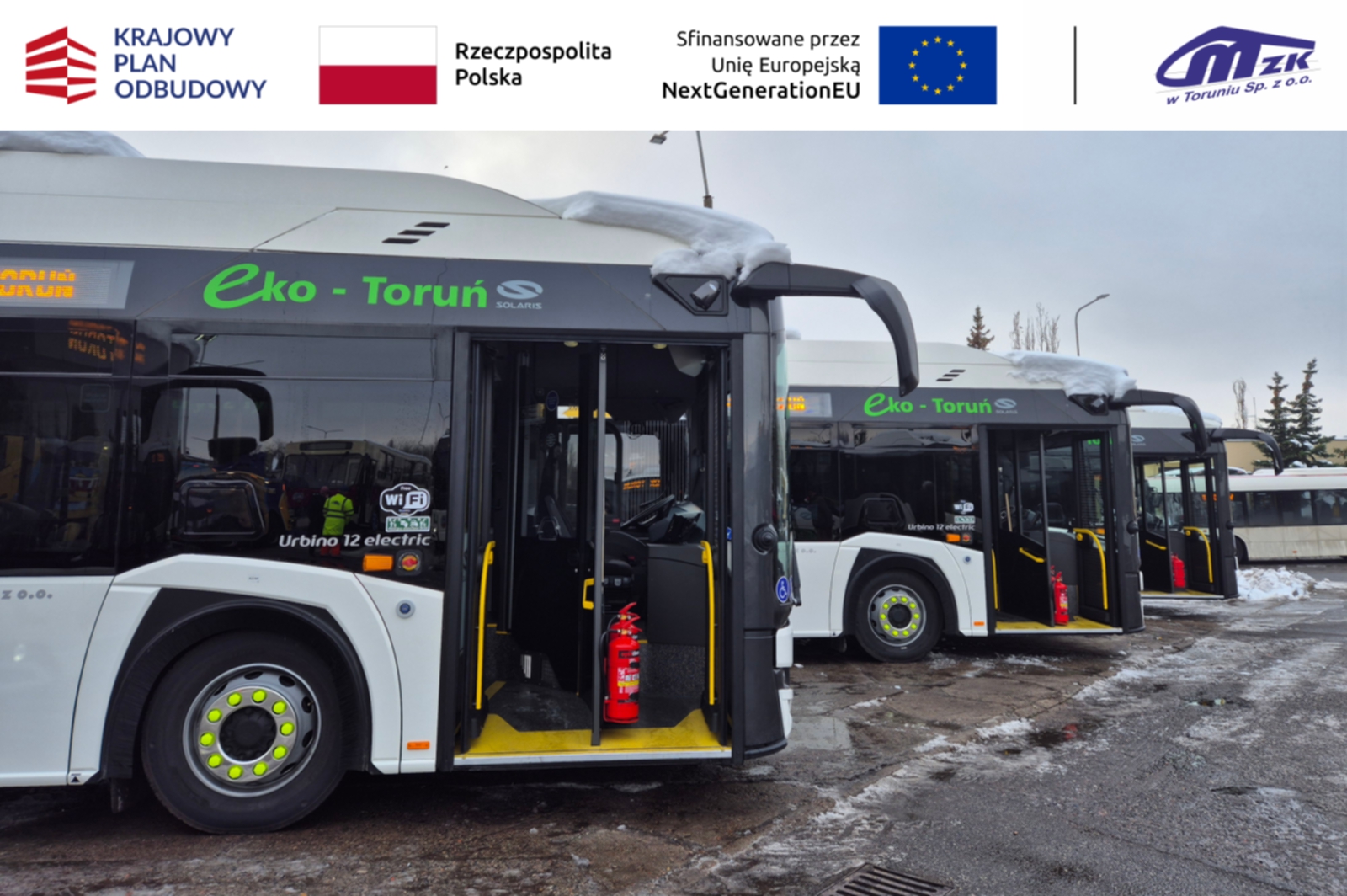 miejski autobus elektryczny koloru białego stojacy na parkingu